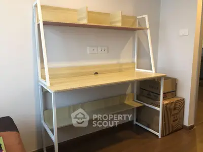 Modern study desk with shelving in a cozy home office setting, perfect for productivity and organization.
