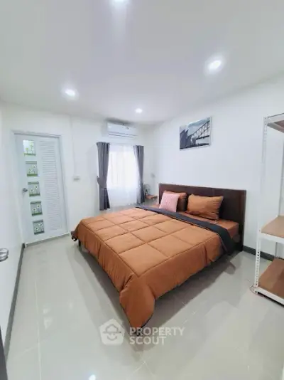 Modern bedroom with stylish decor and natural light