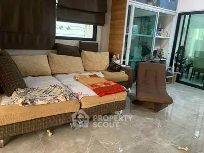 Spacious living room with modern sofa and glass sliding doors