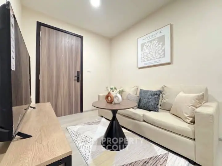 Cozy living room with modern decor and neutral tones, perfect for relaxation.