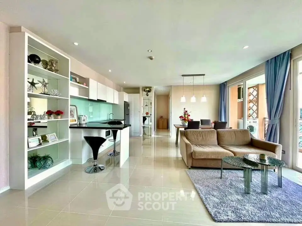 Spacious modern living room with open kitchen and elegant decor