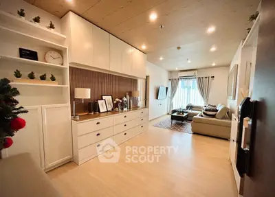 Stylish living room with modern decor and ample natural light, perfect for relaxation and entertainment.