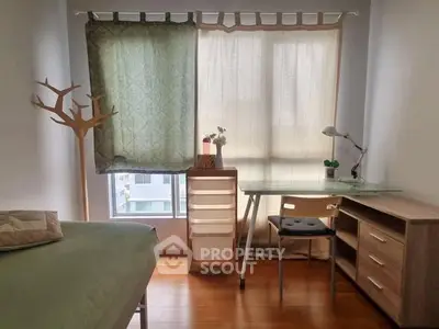 Cozy bedroom with natural light and minimalist decor