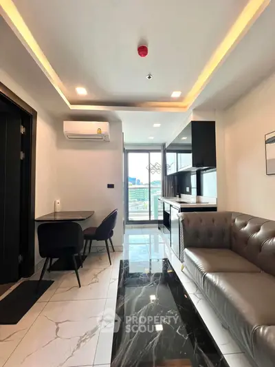 Modern living room with sleek furniture and city view, featuring a stylish open kitchen layout.
