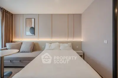 Modern bedroom with stylish decor and cozy ambiance, featuring a comfortable bed and elegant lighting.