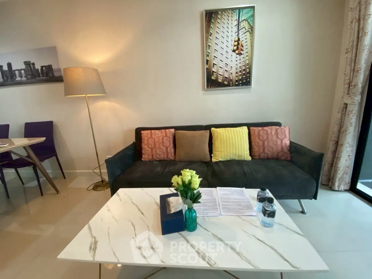 Modern living room with stylish decor and cozy seating area, perfect for relaxation and entertaining.
