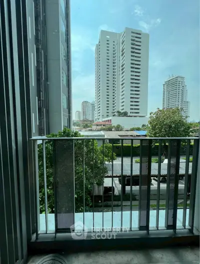 Modern urban balcony with city skyline view, perfect for enjoying the vibrant city life.