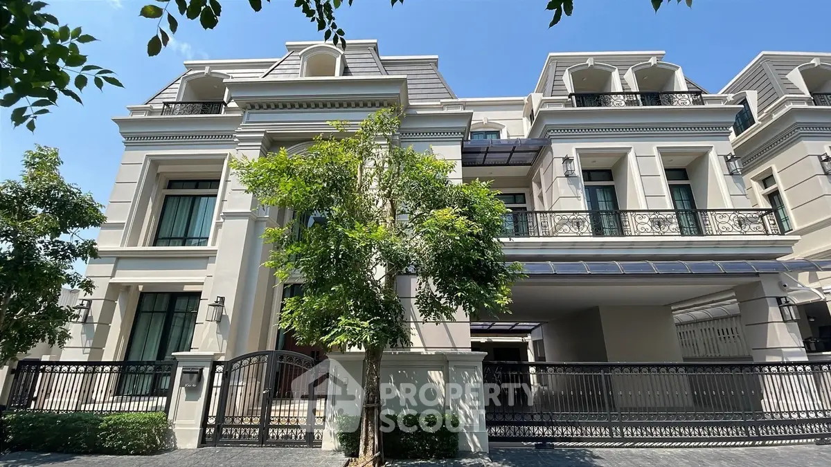 Luxurious modern villa with elegant facade and spacious balconies in a serene neighborhood.