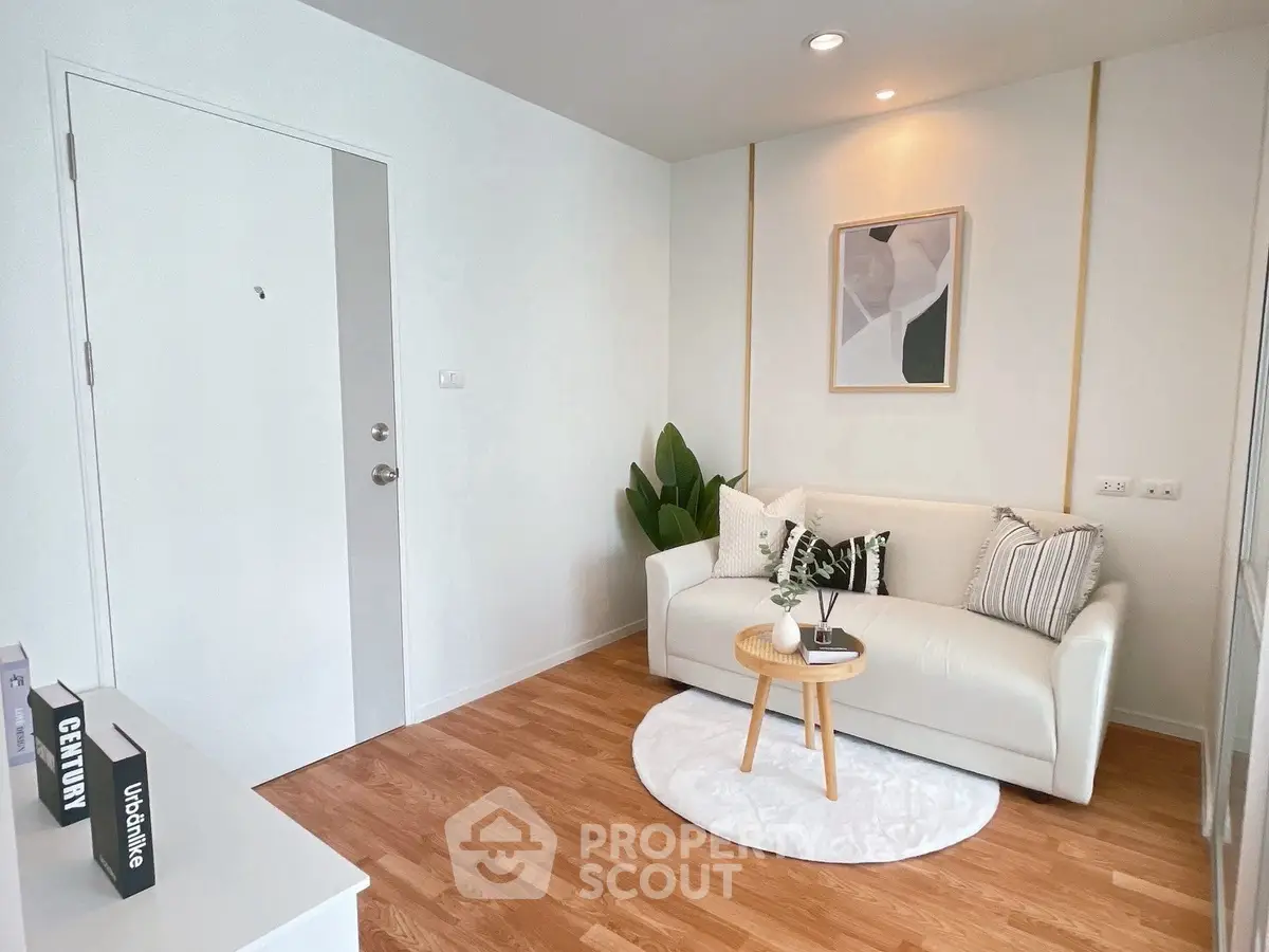 Charming living room with cozy white sofa and modern decor