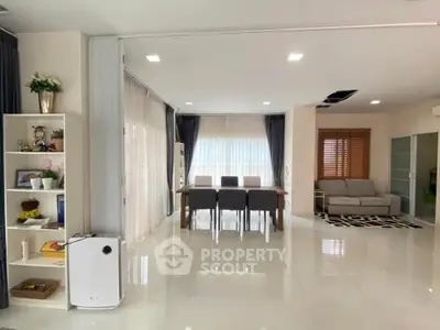 Spacious modern living and dining area with elegant decor and natural light