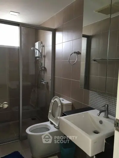 Modern bathroom with glass shower and sleek fixtures