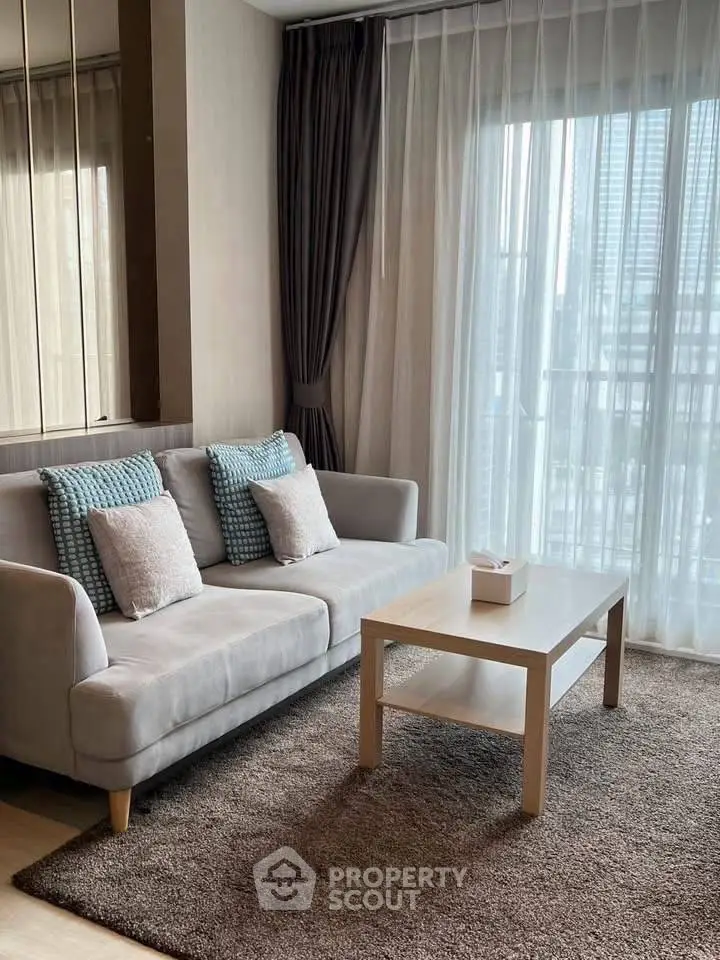 Modern living room with cozy sofa and large window view