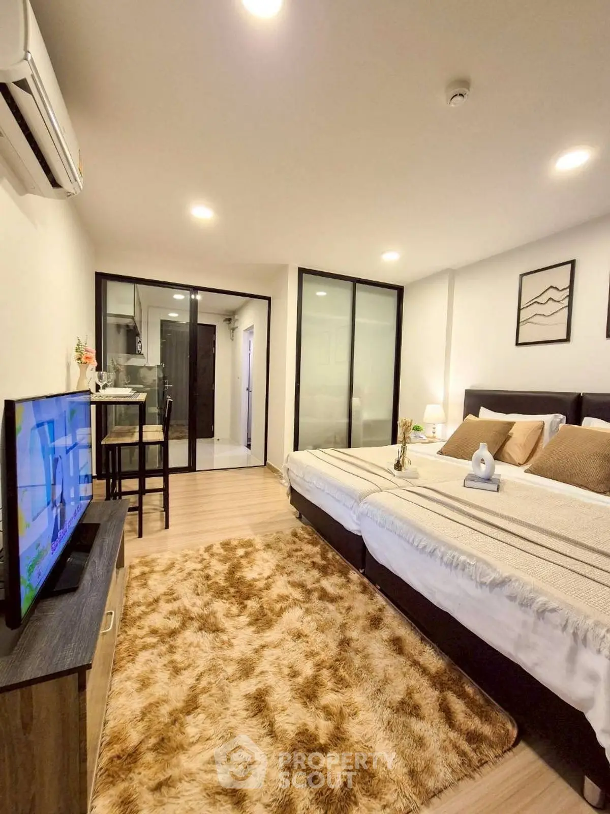 Modern bedroom with cozy decor and open layout in stylish apartment