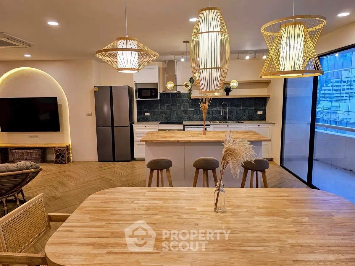 Spacious modern kitchen with open layout and stylish lighting