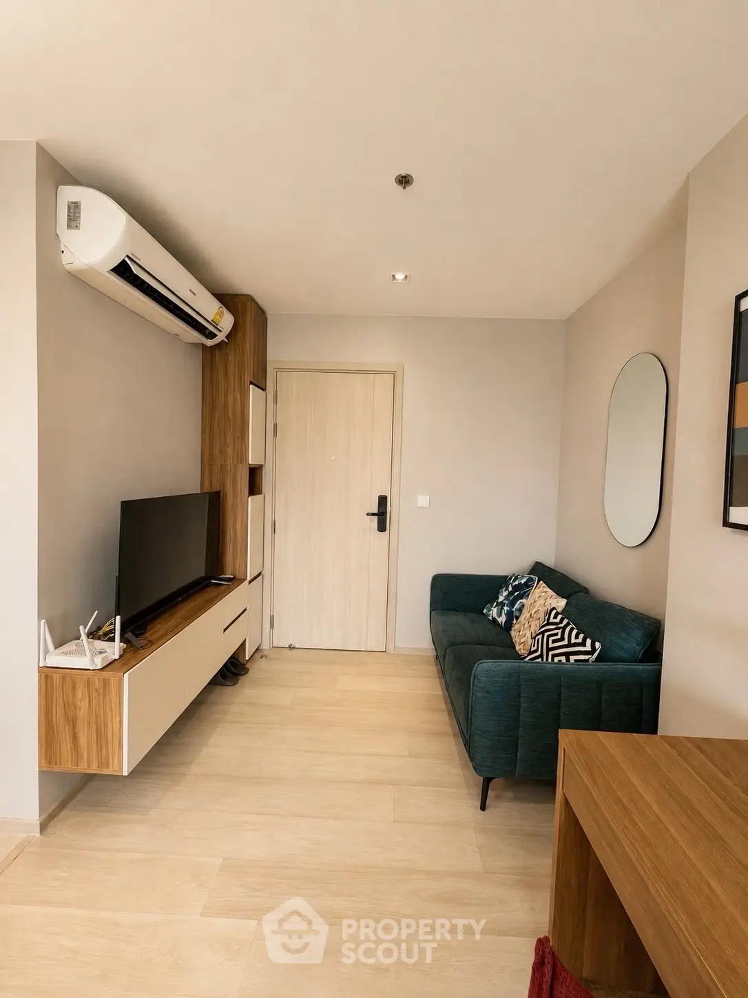 Modern living room with stylish decor and air conditioning in a cozy apartment.