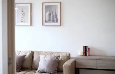 Modern living room with beige sofa and minimalist decor