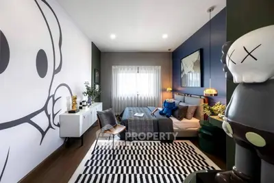 Stylish modern bedroom with unique wall art and cozy decor