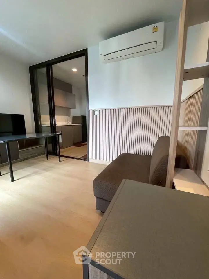 Modern living room with air conditioning and open kitchen layout