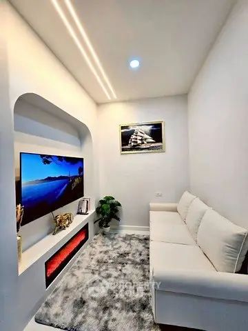 Modern living room with sleek design and cozy ambiance