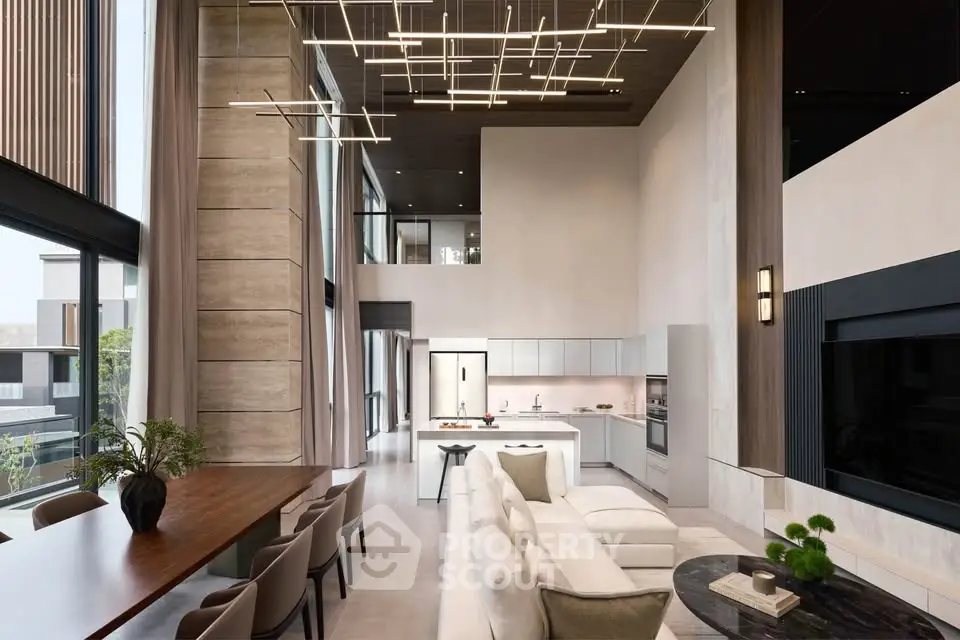 Luxurious modern living room with high ceilings and open kitchen layout