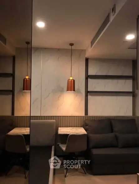 Modern living room with stylish lighting and cozy seating area