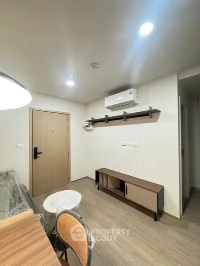 Modern apartment interior with air conditioning and stylish furniture