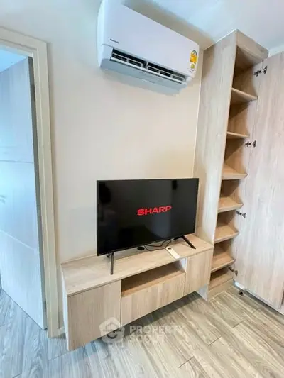 Modern living room with air conditioning and sleek wooden TV stand