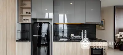 Modern kitchen with sleek black appliances and glossy cabinets