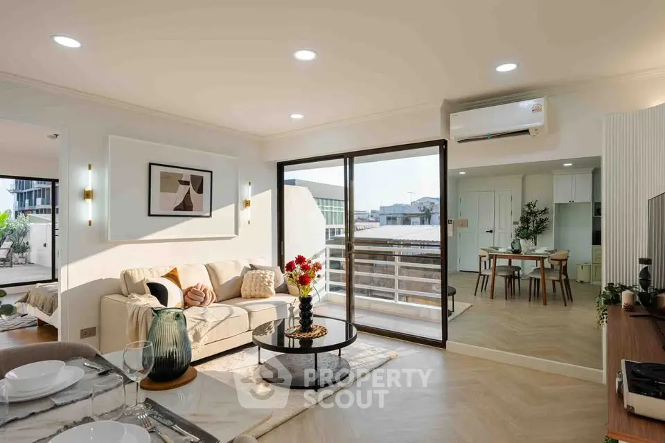 Spacious modern living room with open layout and balcony access
