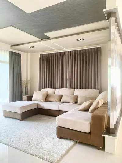 Spacious living room with modern sectional sofa and elegant decor
