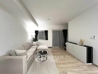 Spacious modern living room with elegant decor and cozy seating area