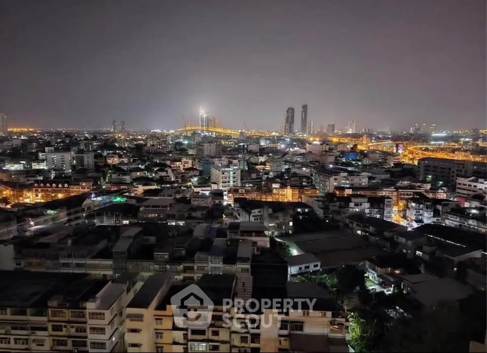 Stunning cityscape view showcasing vibrant urban lights and skyline at night.