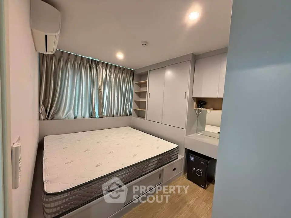 Modern compact bedroom with built-in storage and sleek design