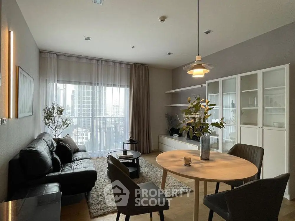 Modern living room with stylish furniture and city view, perfect for urban living.