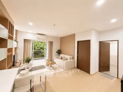 Spacious modern living room with open layout and balcony view