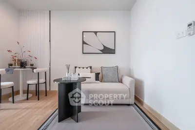 Modern living room with stylish decor and cozy seating area, perfect for relaxation and entertaining.