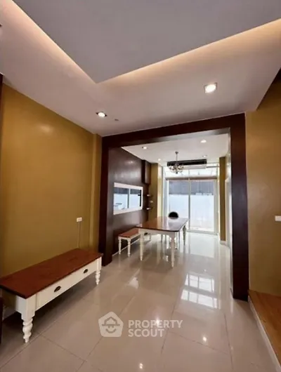 Spacious modern living room with elegant lighting and stylish furniture