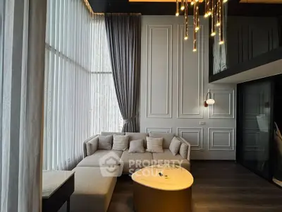 Luxurious modern living room with elegant lighting and floor-to-ceiling windows.