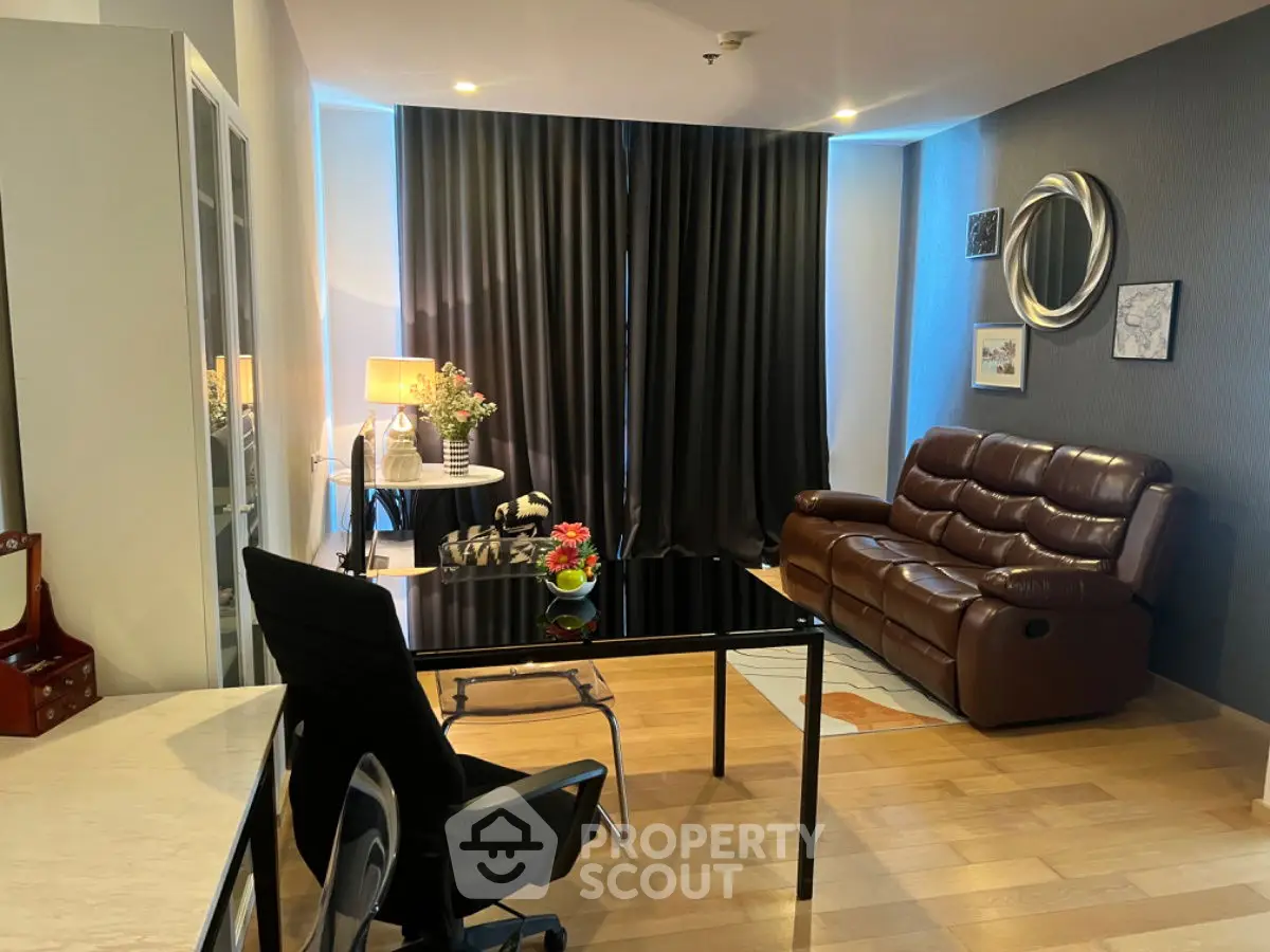 Modern living room with sleek furniture and stylish decor in a cozy apartment setting.