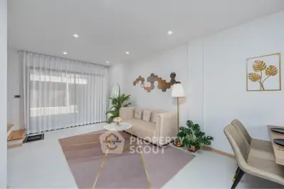 Modern living room with stylish decor, featuring a cozy sofa, elegant lighting, and contemporary wall art.