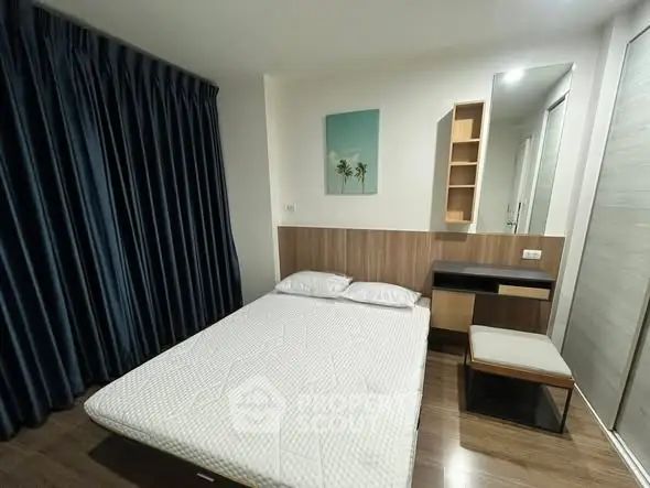 Modern bedroom with cozy decor and stylish furniture in a contemporary apartment.
