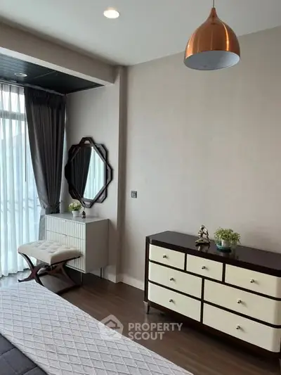 Elegant bedroom with modern decor and natural light