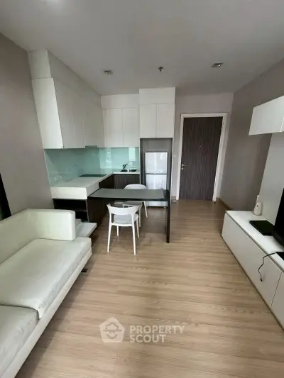 Modern apartment interior with sleek kitchen and cozy living area