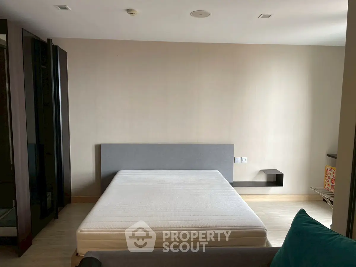 Spacious bedroom with minimalist design and modern furnishings