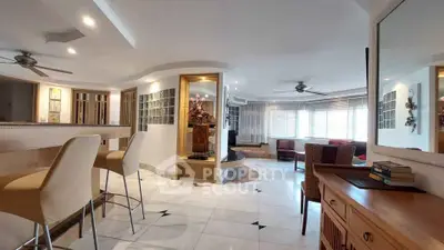 Spacious open-plan living area with modern design and elegant furnishings