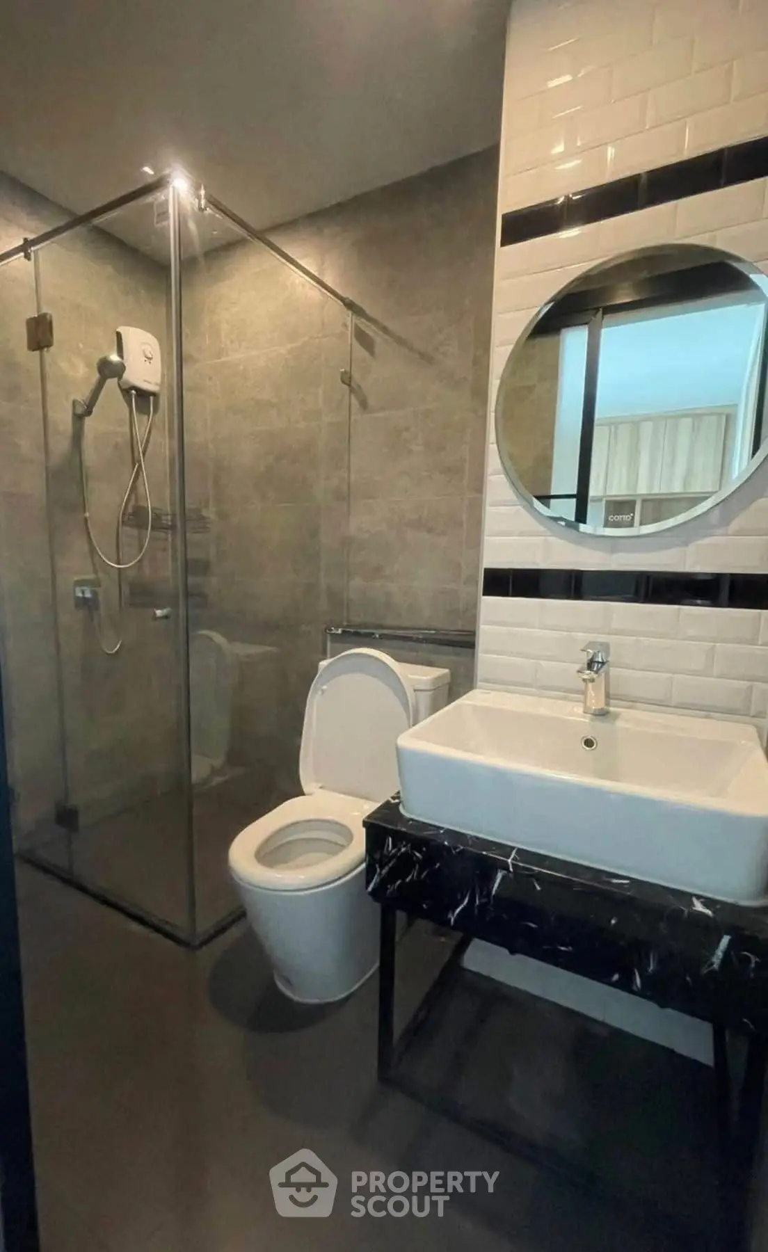 Modern bathroom with glass shower and sleek fixtures