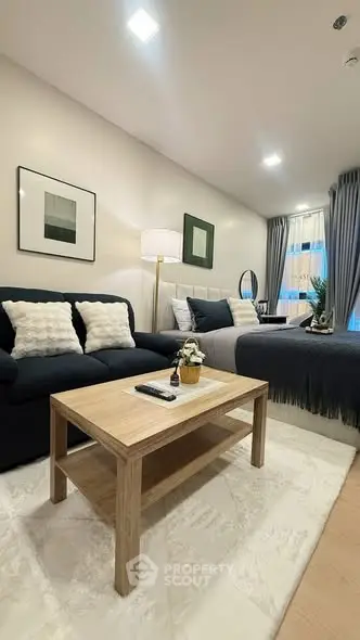 Modern studio apartment with cozy living area and stylish decor