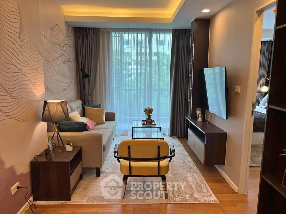 Modern living room with stylish decor and large window view