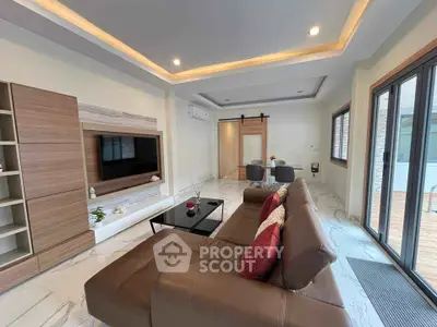 Spacious modern living room with elegant decor and large windows