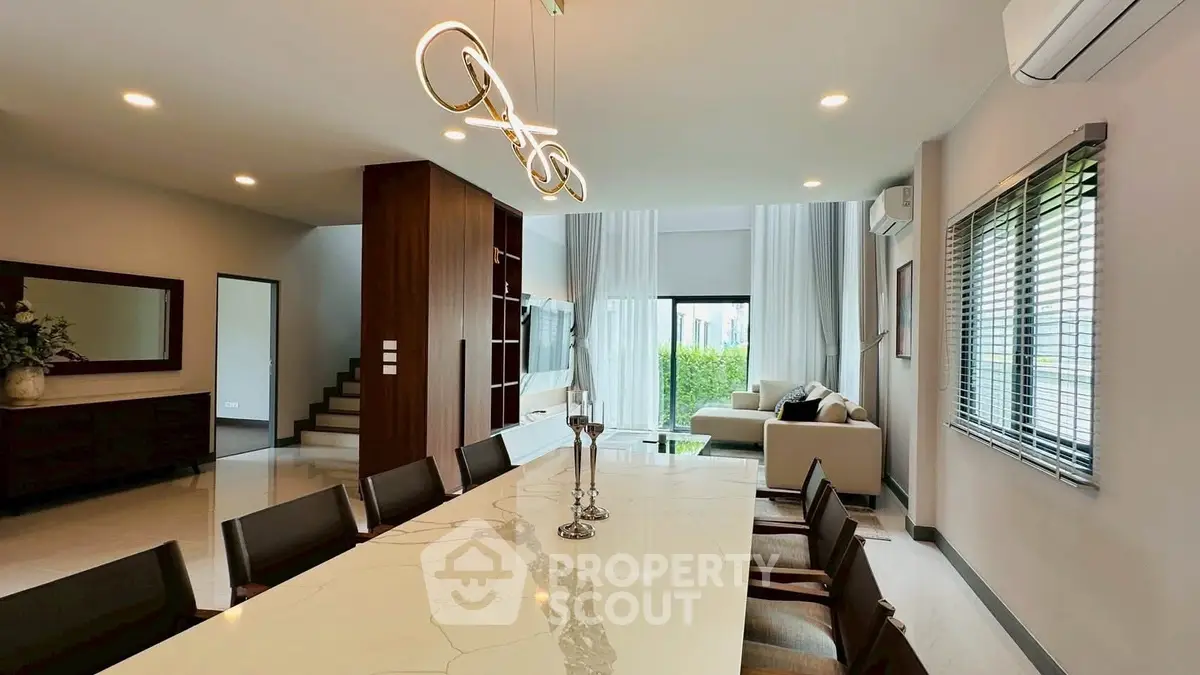 Luxurious modern living room with elegant dining area and stylish lighting